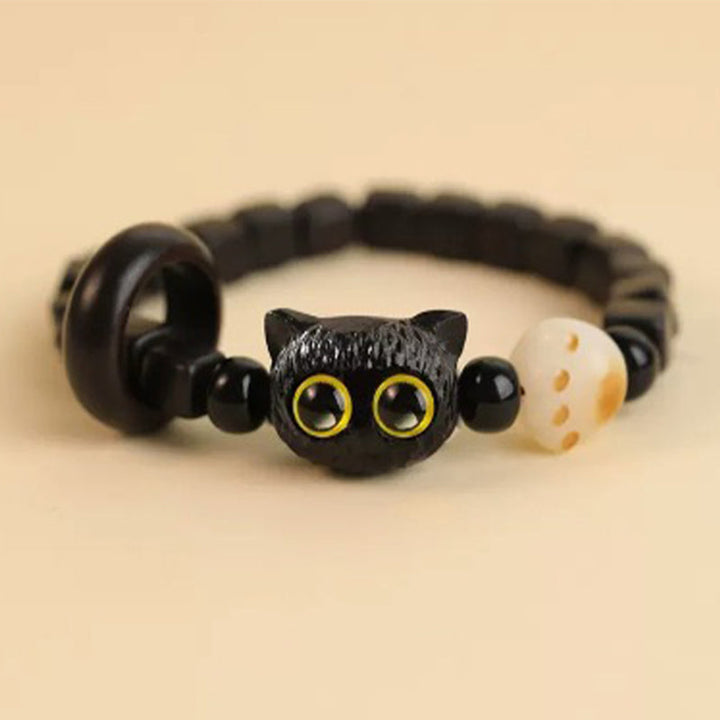Armband Ebenholz Katze mit gelben Augen elastisch schwarz weiß
