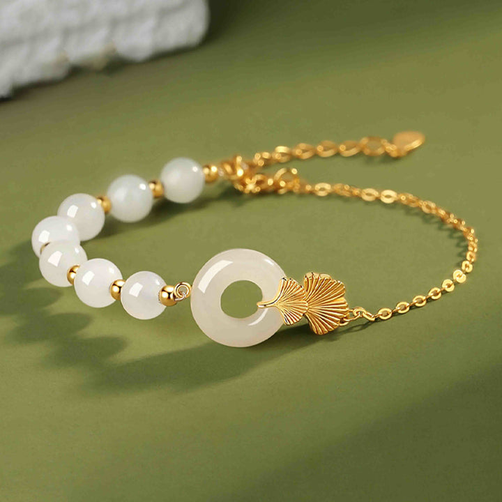 Weißes Jade Armband mit Goldkette elegantes Design Glück Frieden.