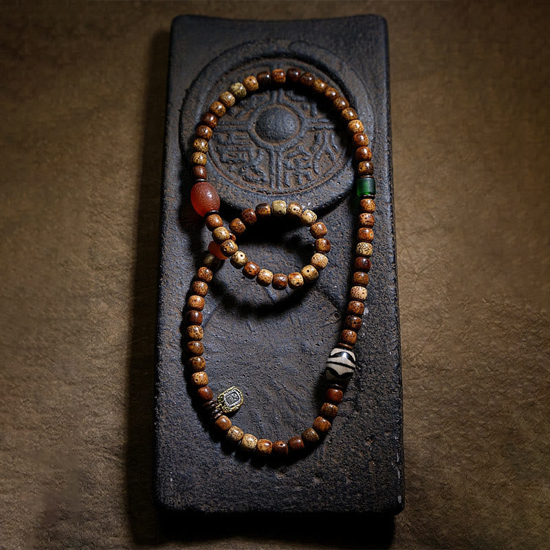 Armband Achat Bodhi – Wohlstand mit Holzperlen auf schwarzem Stein