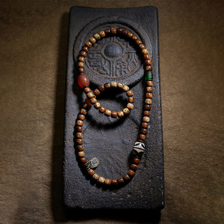 Armband Achat Bodhi – Wohlstand mit Holzperlen auf schwarzem Stein
