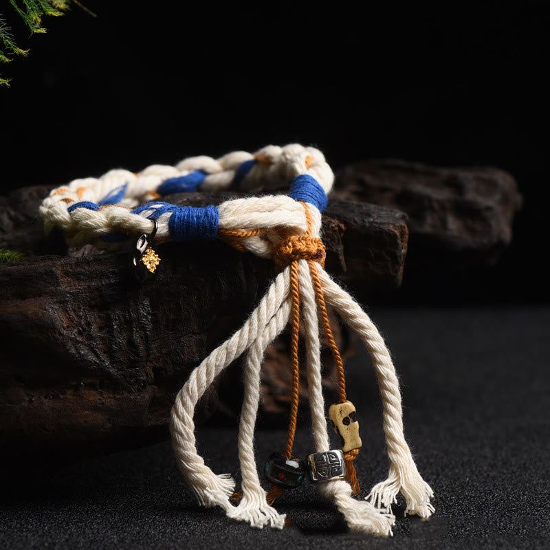 Armband – Glück & Wohlstand & Stärke mit Seilgeflecht und Metallverzierungen.