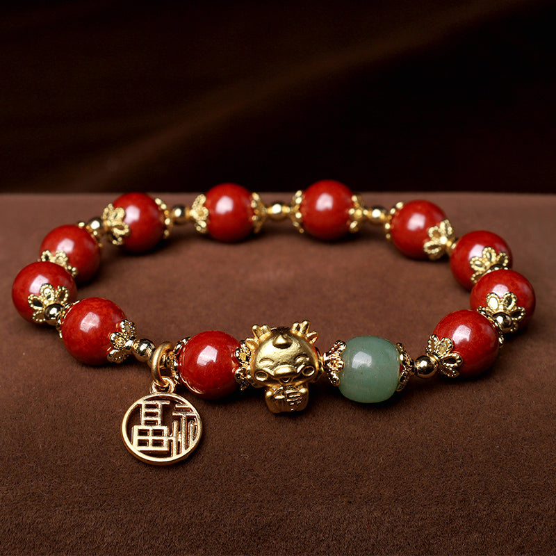 Rotes Armband mit Zinnober, goldenen Perlen und Jade-Anhänger elegantes Design
