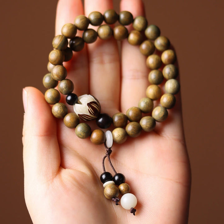 Armband Sandelholz Bodhi Lotus Perlen Handgelenk braun weiß schwarz