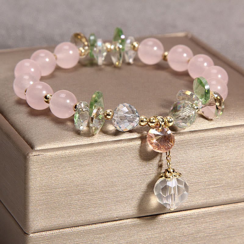 Rosaquarz Kristall Armband mit grünen Perlen und Anhänger elegant.