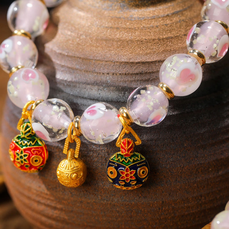 Armband – Liebe & Segen mit rosa Perlen und vergoldeten Anhängern