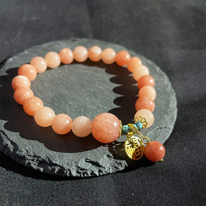 Rosenquarz Armband mit goldenem Fu-Zeichen Anhänger Glück