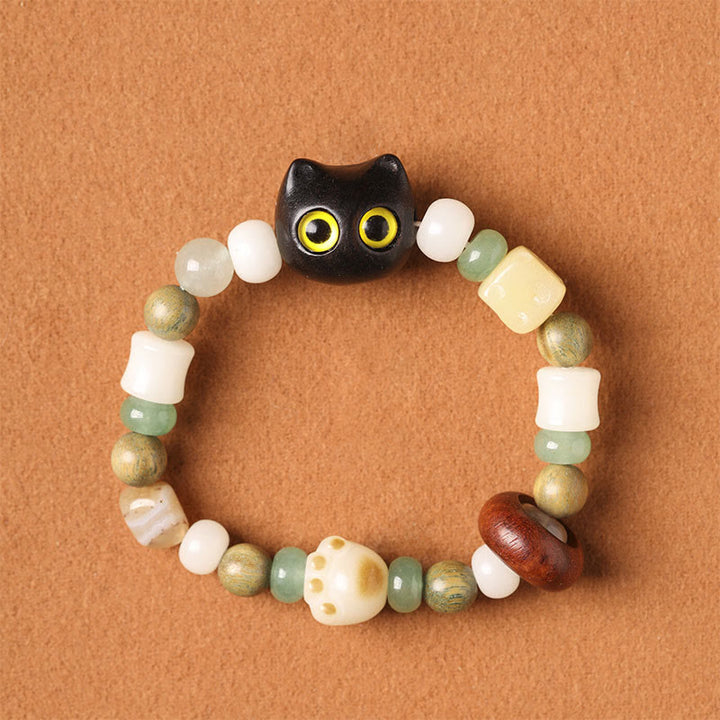 Armband Sandelholz Bodhi Katze mit grünen weißen Perlen Frieden