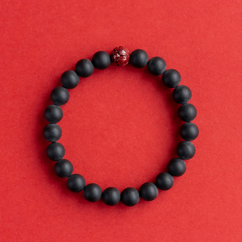 Armband Zinnober Lotus – Heilung schwarze Perlen rotes Accent
