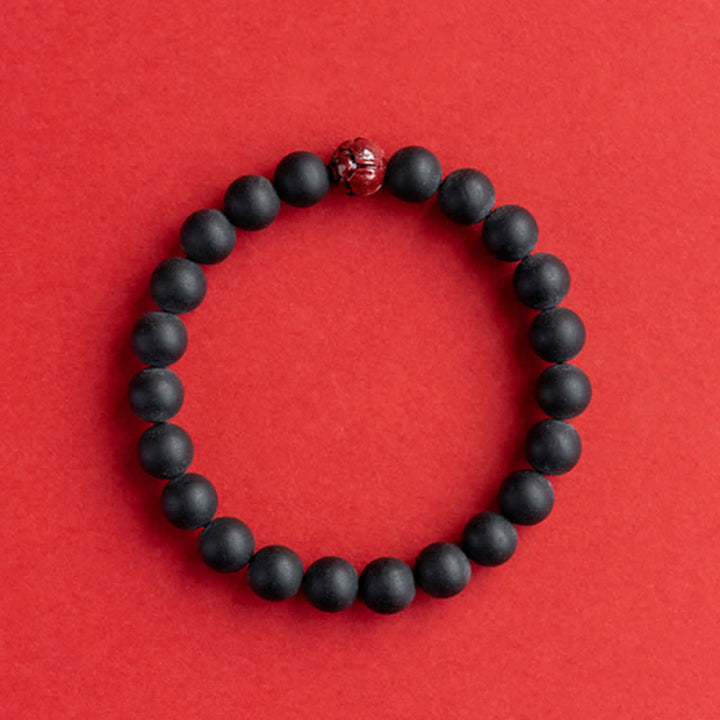 Armband Zinnober Lotus – Heilung schwarze Perlen rotes Accent