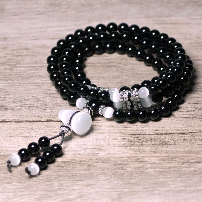 Armband Weißer Kristall Schwarzer Onyx mehrreihig elastisch elegant