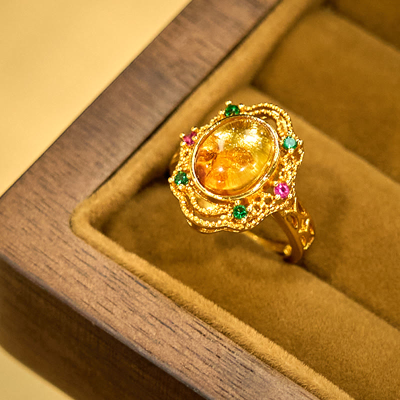 Eleganter Ring Bernstein Blume aus Gold mit grünen und rosa Steinen