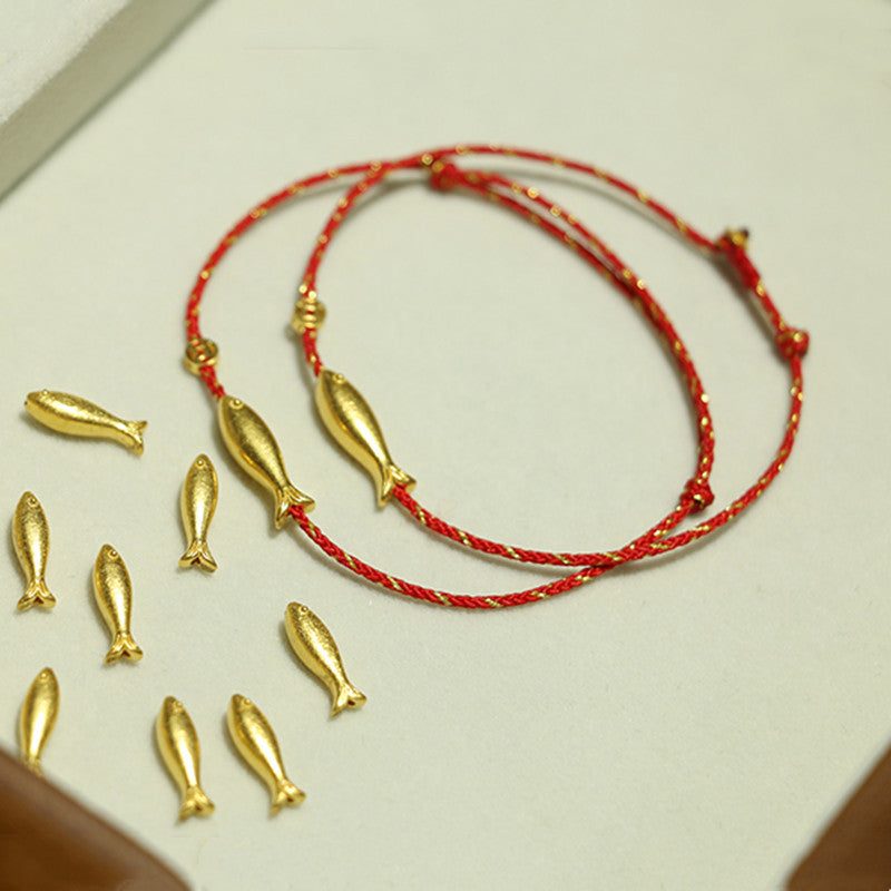 Armband Koi Fisch – Glück & Wohlstand Segen, rote Schnur, goldene Fischanhänger.