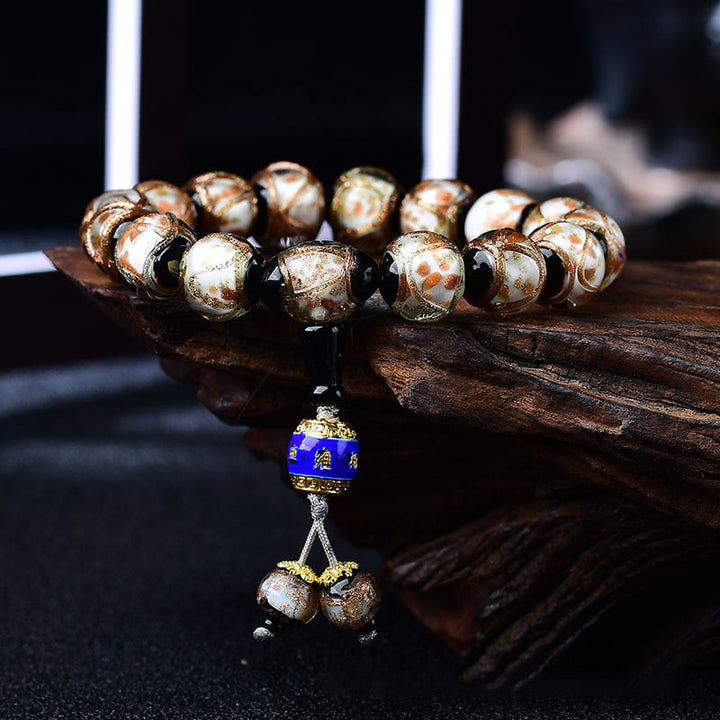 Armband Achat Drachen – Heilung mit braunen Natursteinen und blauem Anhänger.