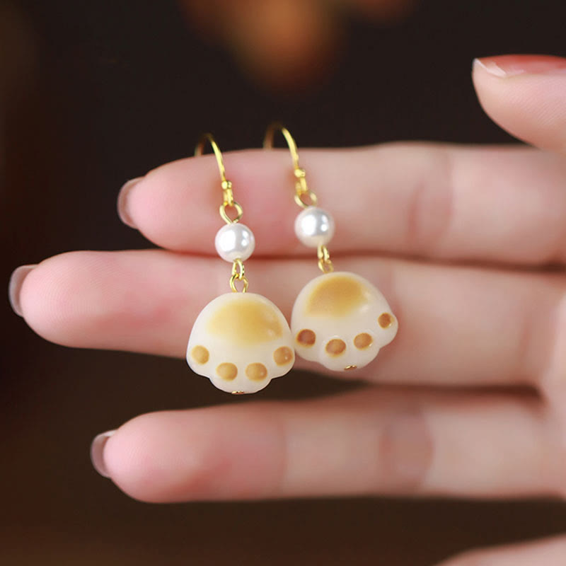 Ohrringe Bodhi-Samen Katzenpfote Perle gold getragen niedlich Schmuck spirituell