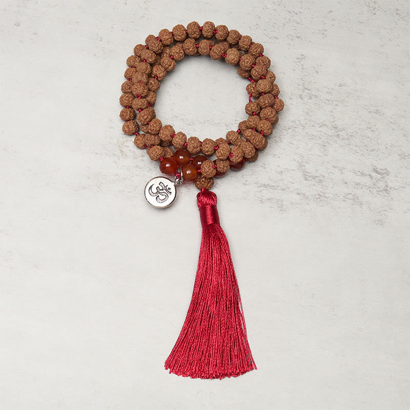 Mala Bodhi – Wohlstand & Balance mit Rudraksha Karneol und roter Quaste