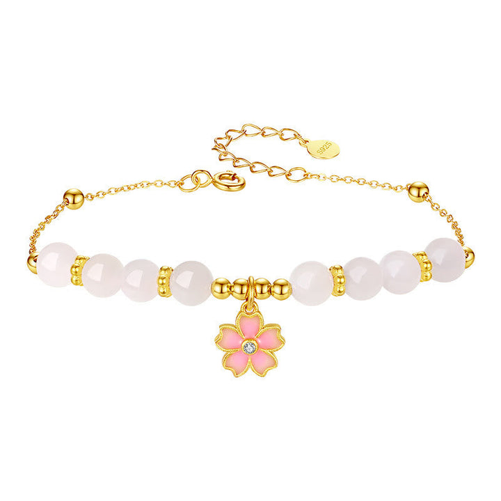 Armband 925 Silber weiße Jade rosa Blütenanhänger goldfarbig elegant