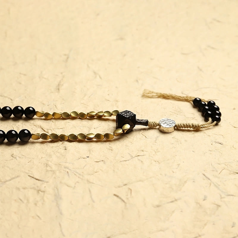 Mala Schwarzer Onyx Schutz Armband mit goldenen Perlen Quaste