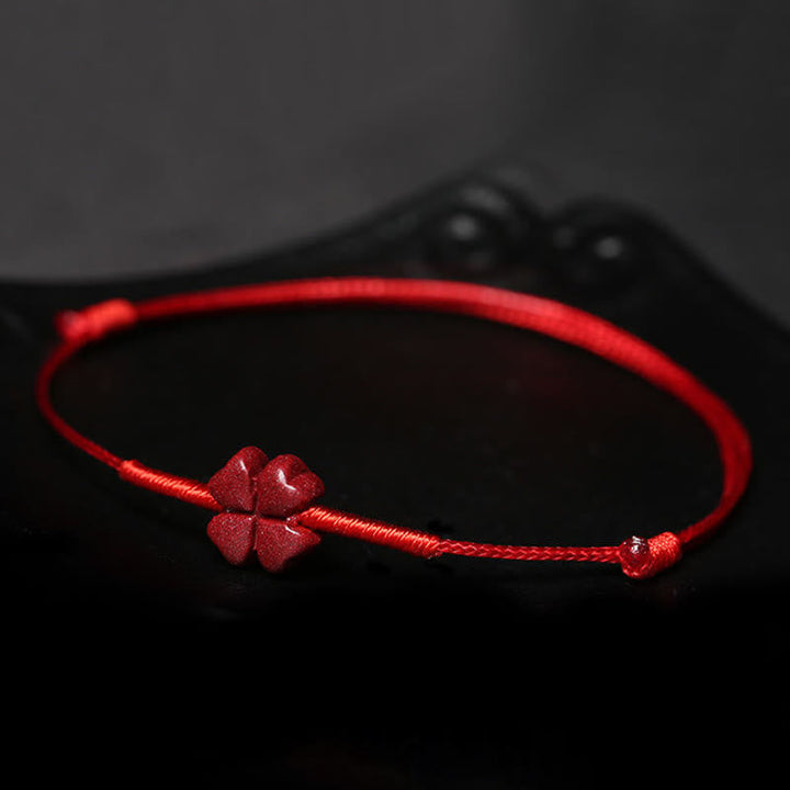 Rotes Armband mit Klee-Charm Zinnober Koi Fisch Liebe Segen elastisch