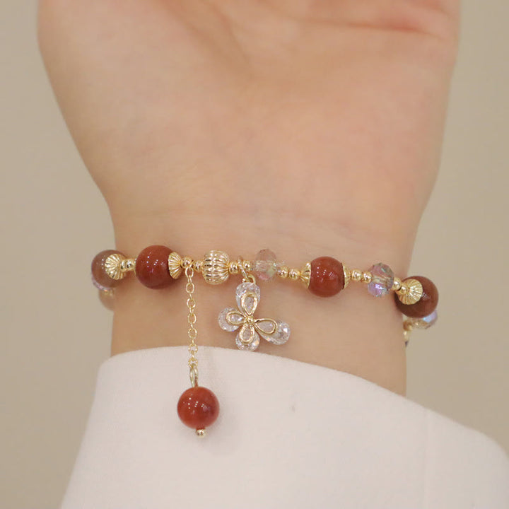 Armband Kristall Schmetterling Wohlstand rote Perlen Gold elegant Handgelenk