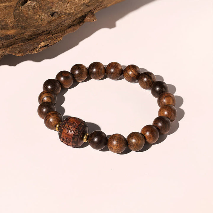 Armband Rosenholz Fu-Zeichen braune Perlen Holzschmuck elastisch natürlich
