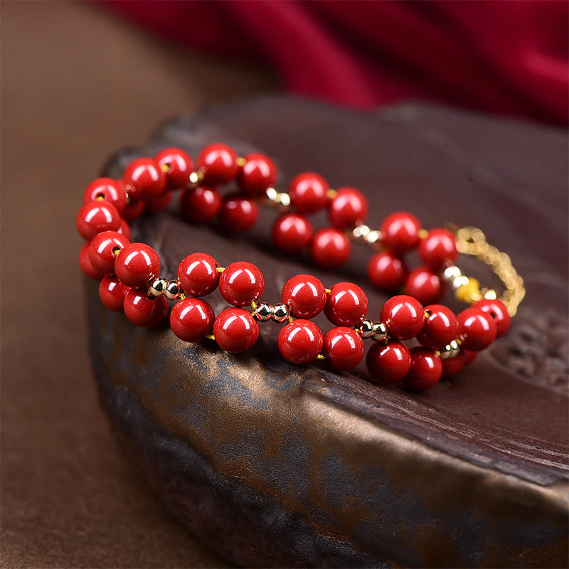 Armband Zinnober – Segen Harmonie rote Perlen Naturstein glänzend elegant
