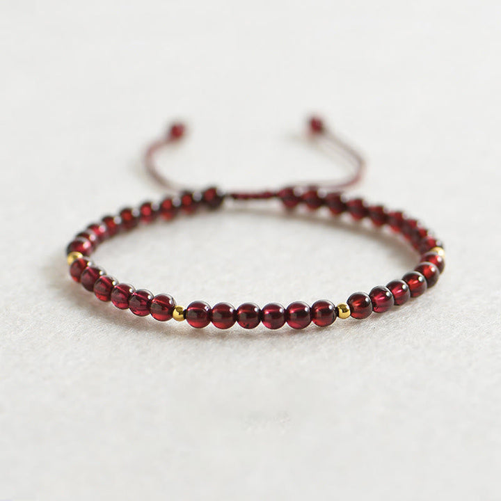 Armband Granat goldene Perlen Stabilität elastisch Naturstein glänzend