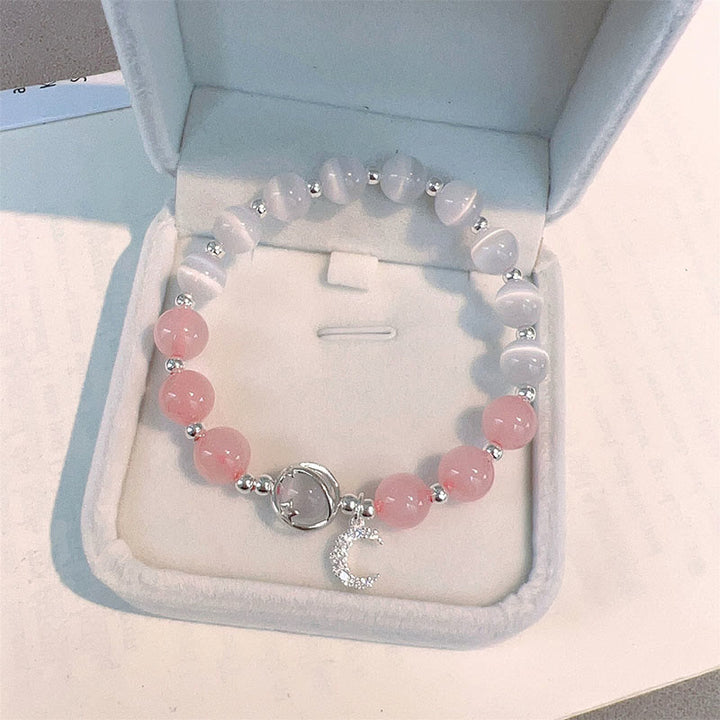 Armband Kristall Mond Liebe mit rosa Steinen und Mondanhänger silberfarben.