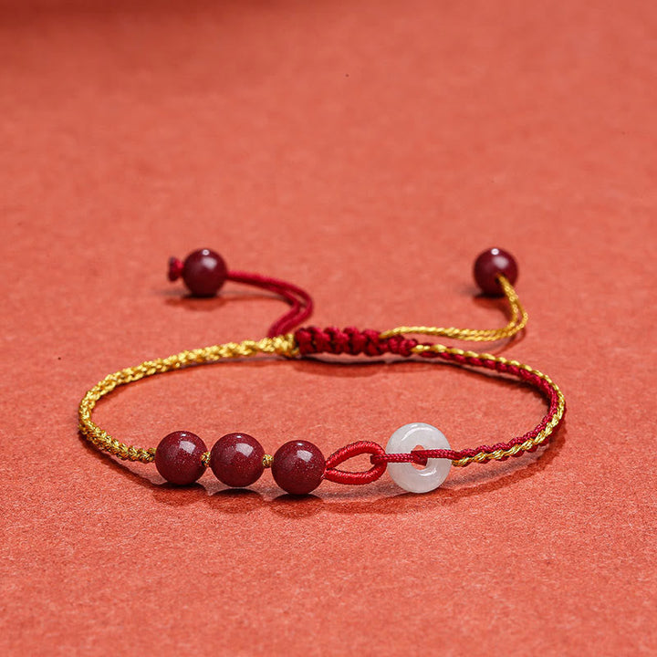 Armband Zinnober Jade mit roten Perlen und weißem Stein elegant.