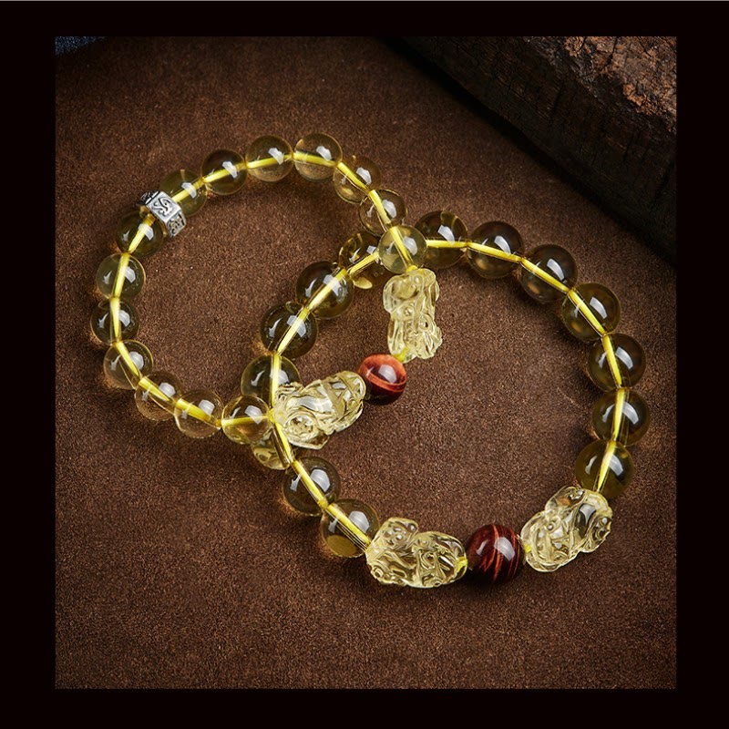 Armband Tigerauge Citrin Pixiu mit goldenen Perlen und roten Steinen elastisch.