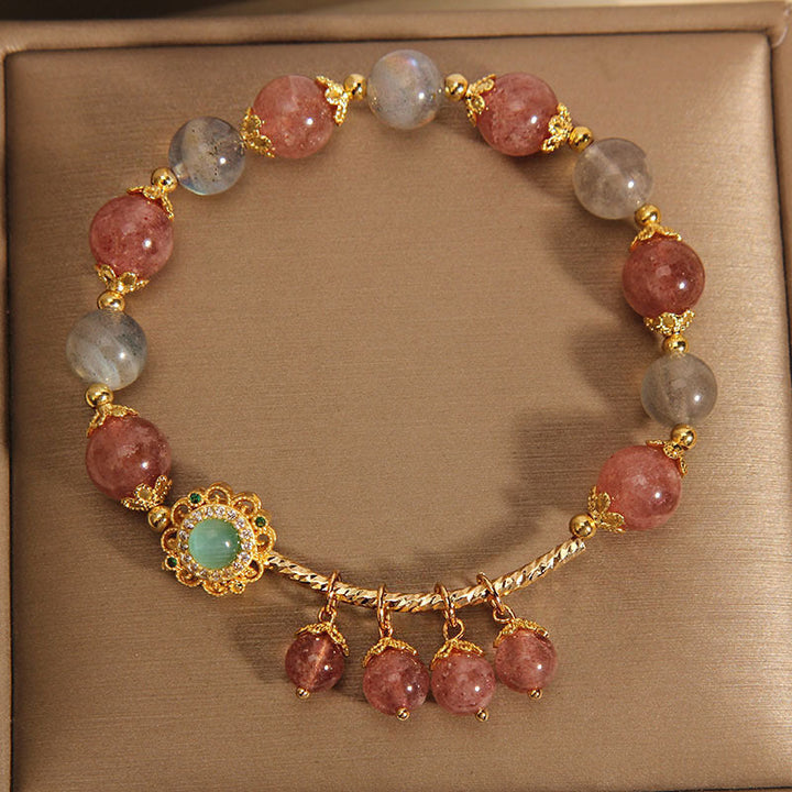 Armband Erdbeerquarz Mondstein goldene Perlen Schmuckkasten elegant