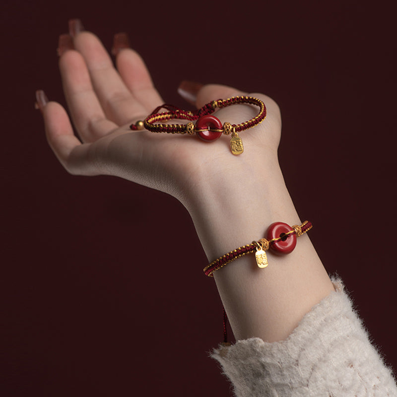 Armband Zinnober Fu-Zeichen Frieden Segen elastisch Naturstein Handgelenk getragen