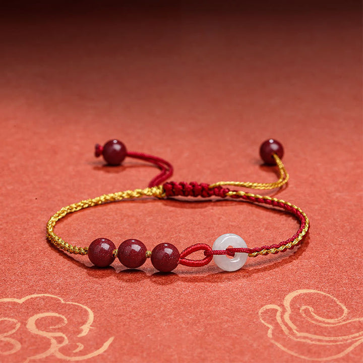 Armband Zinnober Jade mit roten Perlen weißem Stein elegantes Design