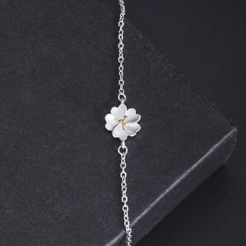 Silberarmband 925er Silber mit weißer Blüte Anhänger elegant.