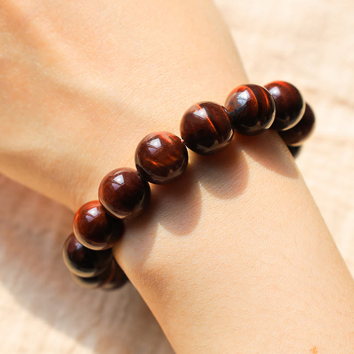 Armband Tigerauge – Heilung & Energie braune glänzende Kugeln Handgelenk