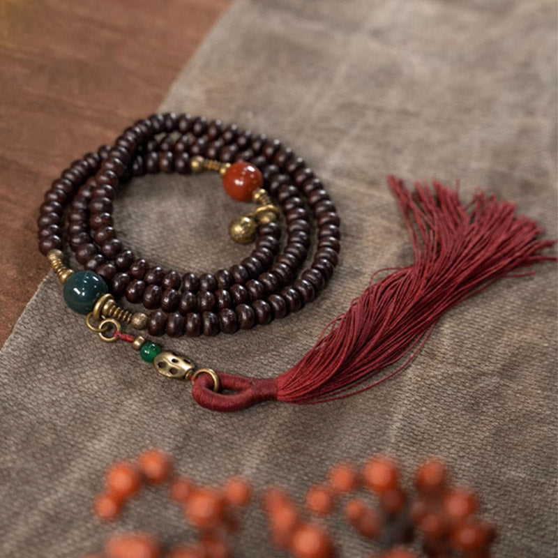 Mala 108 Perlen Bodhi – Stärke Armband braun Quaste rot Naturstein
