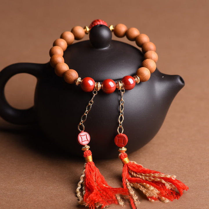 Armband Zinnober Pixiu – Wohlstand mit roten Perlen und Quasten.