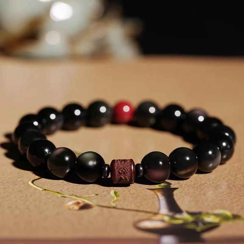 Schwarzes Obsidian Armband mit roten Perlen Heilstein Schmuck elegant.