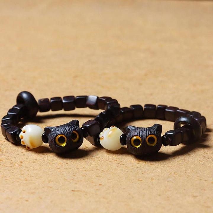 Armband Bodhi Ebenholz Katze mit weißen Perlen elastisch