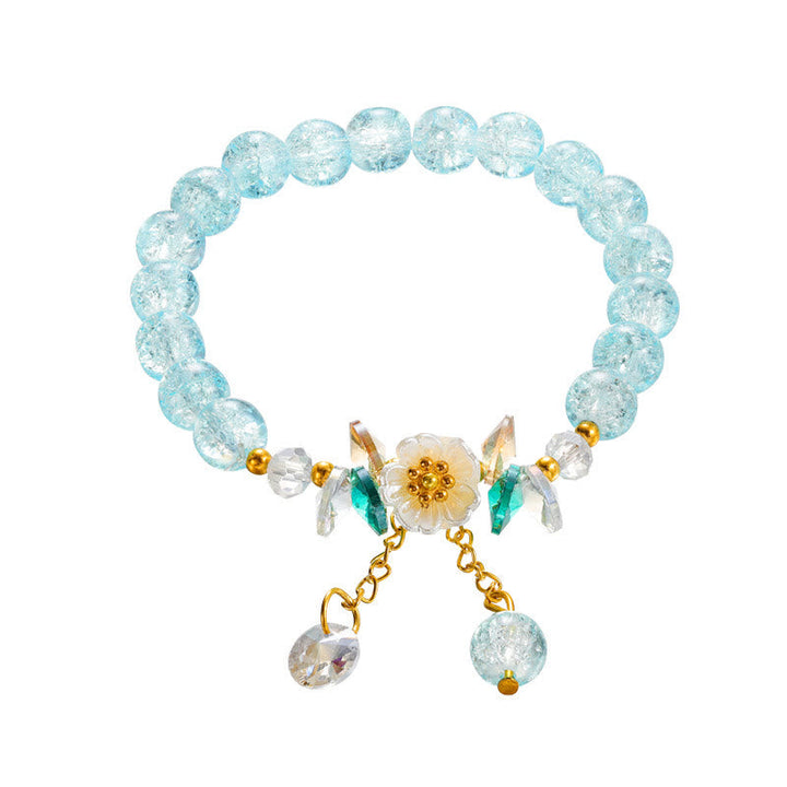 Armband Blume Glas mit türkisen Perlen und goldenem Anhänger