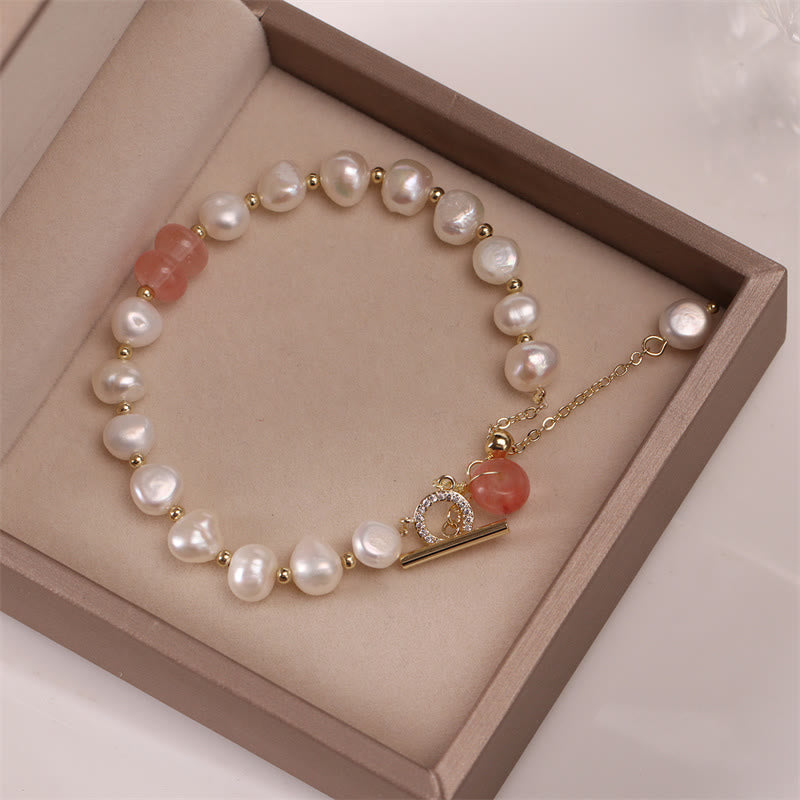 Armband Erdbeerquarz Perle Heilung Energie eleganter Schmuck Geschenkbox präsentiert