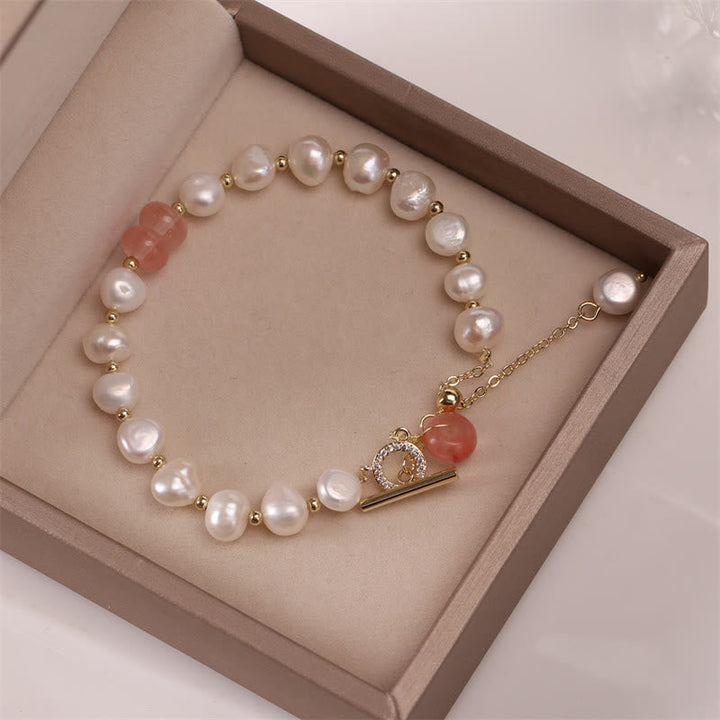 Armband Erdbeerquarz Perle Heilung Energie eleganter Schmuck Geschenkbox präsentiert