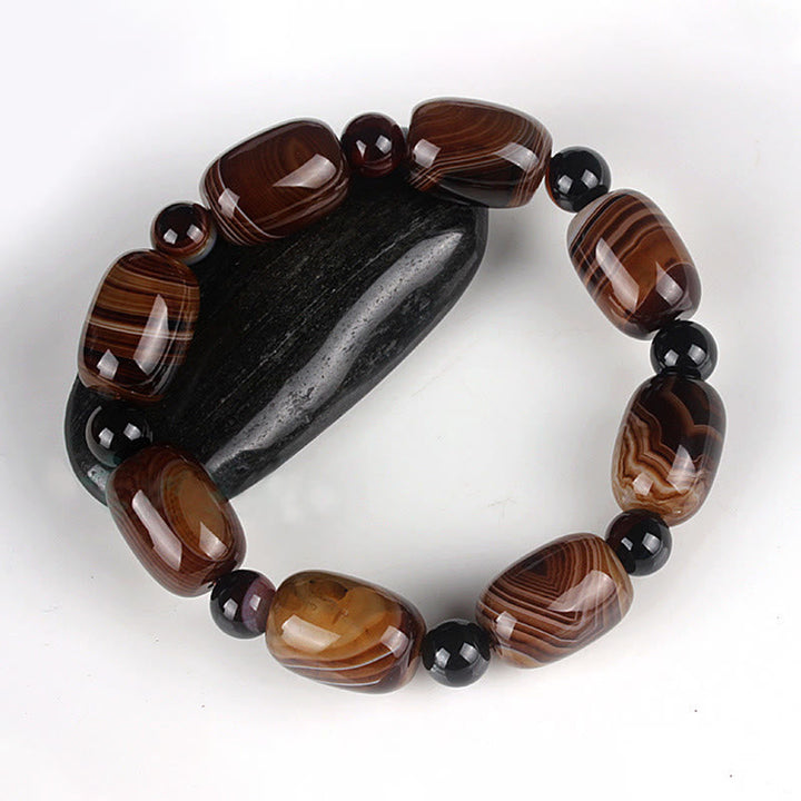 Armband Onyx – Glück & Mut mit braunen Steinen und schwarzen Perlen elegant.