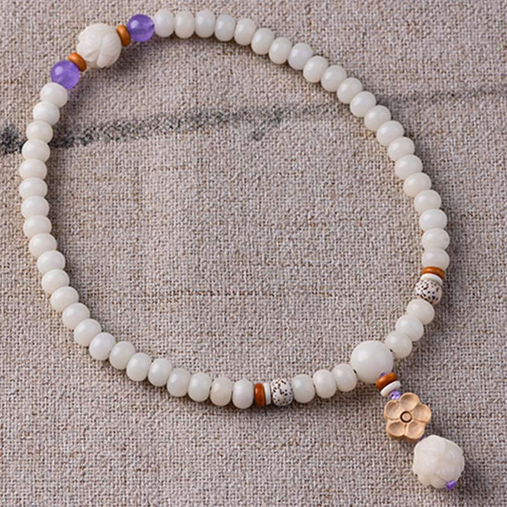 Armband Weiße Jade Bodhi Lotus mit lila Amethyst Perlen elastisch