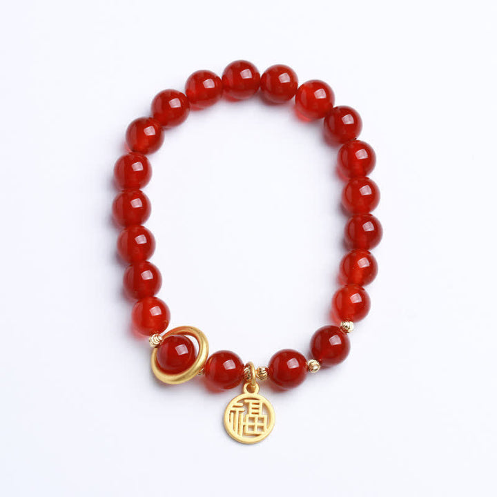 Armband Roter Achat mit goldenem Segen Anhänger elastisch