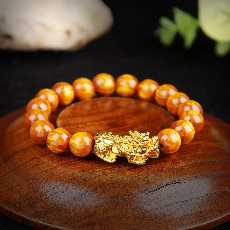 Armband Tigerauge Pixiu Glück goldener Verschluss orangebraune Perlen Flachaufnahme