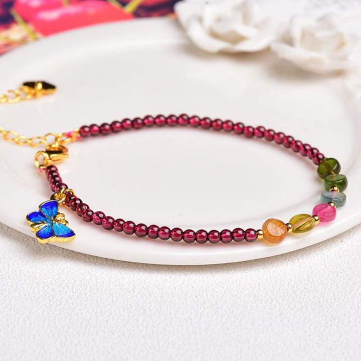 Armband Granat Schmetterling – Schutz rote Perlen goldener Schmetteling elegant
