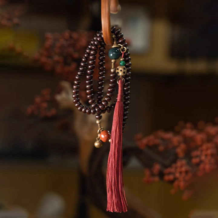 Mala 108 Perlen Bodhi Stärke Armband mit roter Quaste Edelsteinen