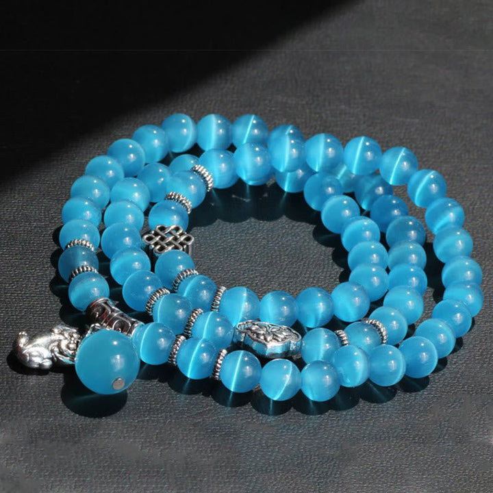 Armband Katzenauge PiXiu Dreifach blauer Stein elastisch Perlen