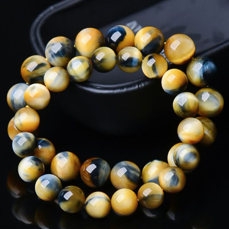 Armband Tigerauge – Schutz & Stärke, facettierte goldbraune Perlen elastisch.