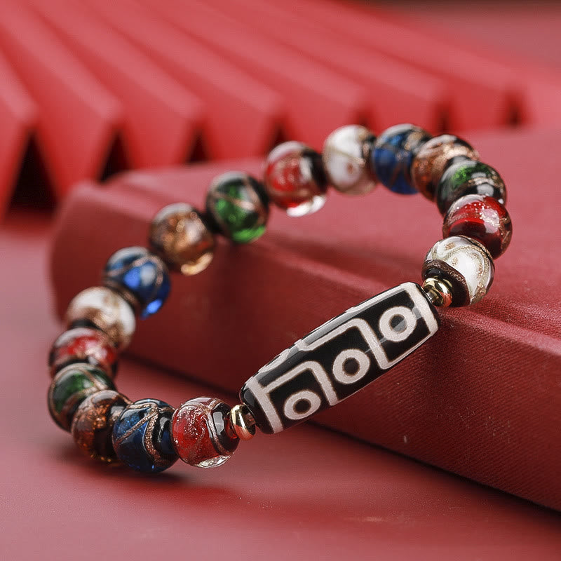 Armband – Wohlstand Balance mit farbigen Perlen und silbernem Anhänger